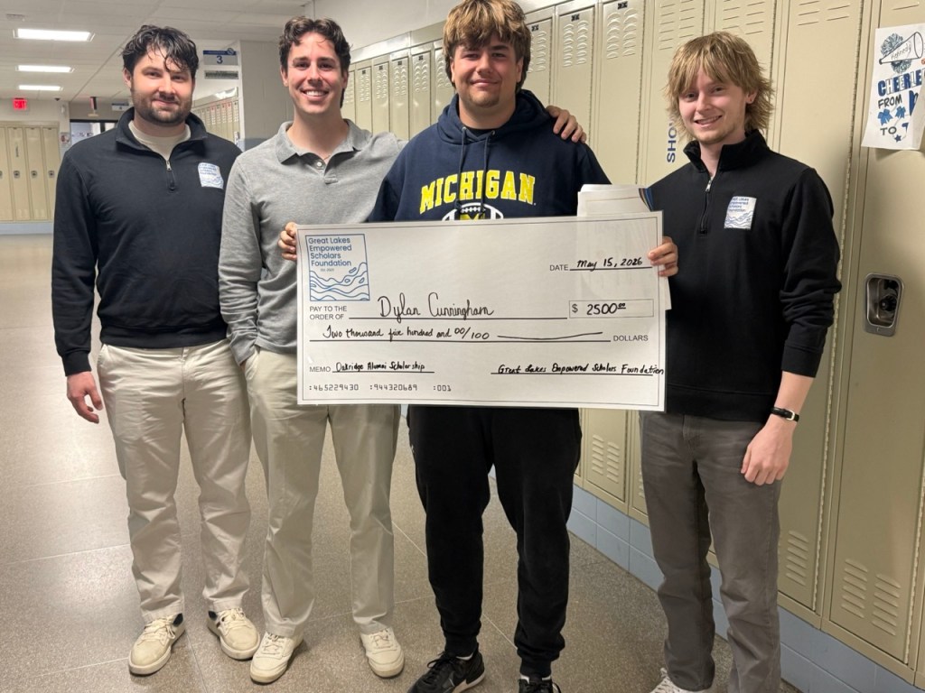 Dylan Cunningham receiving the 2026 Oakridge Alumni Scholarship check from Great Lakes Empowered Scholars Foundation